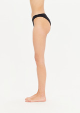 THE UPSIDE Camp Cove Moss Pant in Black is a recycled mid coverage bikini pant in our soft recycled ribbed fabrication.
