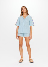 THE UPSIDE Castillo Crochet Lovett Shirt in Mist Blue is a crochet button-down collared shirt with contrast stripe detail down sleeves and cream edge stitch around collar, hems and cuffs.