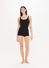 THE UPSIDE Camp Cove Kelia Surfsuit in Black is a recycled surfsuit with a scoop neck front and back and full coverage boy leg cut.