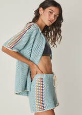 THE UPSIDE Castillo Crochet Hali Short in Mist Blue is a pure cotton crochet short with elastic waist, knitted drawcord, contrast stripe detail down sides and cream edge stitching around hem.