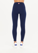 THE UPSIDE Banff 28inch Pant in Navy is a full length 28” legging with contrast white piping along black side panels, zipper detailing and contrast white twin needle stitching.