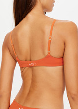 THE UPSIDE x THE BANYA orange rust Byron Bralette is low coverage, made from soft recycled ribbed fabrication and features a scoop neck with fine adjustable straight back straps.