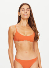 THE UPSIDE x THE BANYA orange rust Byron Bralette is low coverage, made from soft recycled ribbed fabrication and features a scoop neck with fine adjustable straight back straps.