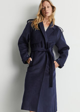 THE UPSIDE Voss Coat in Navy is a heavyweight felted coat with pockets, storm flap and peak lapels, raglan sleeves with belted cuffs and buttons, and removable belt.