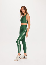 THE UPSIDE Oxford 25inch Midi Pant in Fern Green is a sustainable mid-rise 25” length legging with contrast binds at sides and drawcord waistband.