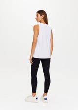 THE UPSIDE White Quick Dry Sarah Tank is made from a recycled dri release fabrication in black and designed for a relaxed fit and features sweat wicking and quick drying properties.