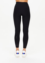 THE UPSIDE women's black Matte Tech 25inch Midi Pant is a mid rise, 7/8 length, matte tech performance legging is made from breathable, quick drying and moisture wicking fabric.