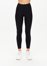 THE UPSIDE women's black Matte Tech 25inch Midi Pant is a mid rise, 7/8 length, matte tech performance legging is made from breathable, quick drying and moisture wicking fabric.