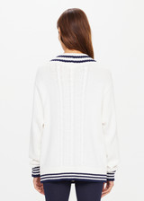 THE UPSIDE womens ivory and navy v-neck Louie Sweater made with organic cotton features a mid-weight knit construction and contrast navy stripes on neckline, cuffs and hems.