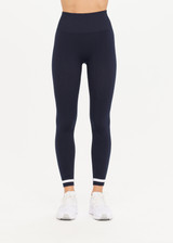 THE UPSIDE womens navy Form Seamless 25in Midi Pant made with Form Seamless fabric features contrast white stripe on ankles, soft ribbed waistband and 25-inch length leg.