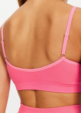 THE UPSIDE womens low-coverage neon pink Ribbed Seamless Ballet Bra made with Ribbed Seamless fabric features elasticated adjustable straps, soft support and moisture control properties.