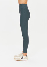 THE UPSIDE womens cool dark blue Ribbed 25In Midi Pant made with Ultra Soft Recycled Rib fabric features a v-shaped high rise waistband, designed for everyday support/wear.