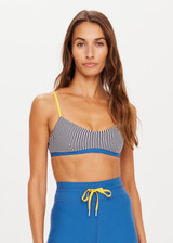THE UPSIDE women’s low-coverage navy and white striped Rise Ballet Bra made with Recycled Peached fabric features contrasting yellow adjustable elastic straps, blue underbust band and moisture wicking properties. Ideal for yoga, pilates and barre.