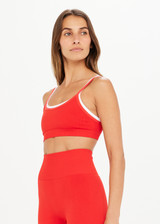 THE UPSIDE women’s double-layer red Form Seamless Bra made with Seamless fabric features a contrasting white underlayer and moisture control properties; firm and supportive, ideal for yoga, pilates or barre.