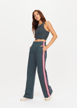 THE UPSIDE womens cool dark blue high waisted wide leg Niseko Monte Pant made with Lenzing viscose soft suiting fabric features elastic waistband, stripe down side seams and side and back pockets.