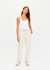 THE UPSIDE womens white straight leg Rodeo Franca Pant made with a soft organic cotton blend features elastic waistband, pockets and white stripes down sides, designed for golf.