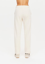 THE UPSIDE womens white straight leg Rodeo Franca Pant made with a soft organic cotton blend features elastic waistband, pockets and white stripes down sides, designed for golf.