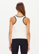 THE UPSIDE women's creme Alcaraz Raf Knit Tank made with organic cotton blend knit fabric features a racerback, contrasting black stripes at neck, armholes and hem, and branded pip on sleeve cuff.