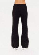 THE UPSIDE women's black Realm Jetset Pant made with soft suiting lenzing viscose fabrication features a straight-leg fit, functional front and back pockets, elastic waist with drawcord, cream piping details and tonal embroidered arrow on back pocket.