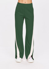 THE UPSIDE women's pine green Petra Flare is a flared pant with splits at front, contrast knitted cream tape down side seams cream tape down the side seams, pockets and elastic at waist.
