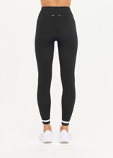 THE UPSIDE women's black mid-rise 25inch legging is made from our form seamless fabric with moisture control properties. It features a soft ribbed waistband and white stripe.