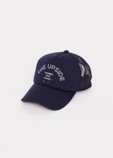 THE UPSIDE women's navy Jetset Trucker Hat is a classic trucker hat with a foam front and mesh back. This lifestyle hat features an adjustable snapper at the back.