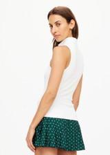THE UPSIDE women's white Player Top is made with recycled ribbed fabric, designed for a slim fit. This sleeveless top features a quarter zip. Designed for tennis.