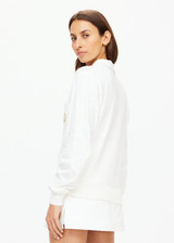THE UPSIDE women's white Baccarat Violette Sweater is made in organic cotton knit on front and soft cotton jersey on back, sleeves and collar. This is a relaxed vintage inspired sweater.