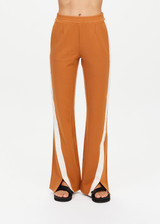 THE UPSIDE women's brown The Banya Petra Flare is made from sustainable lenzing viscose and is a true to size fit. This lifestyle flare pant features white side stripe down the sides, an elastic waist and side seam pockets.