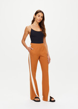 THE UPSIDE women's brown The Banya Petra Flare is made from sustainable lenzing viscose and is a true to size fit. This lifestyle flare pant features white side stripe down the sides, an elastic waist and side seam pockets.