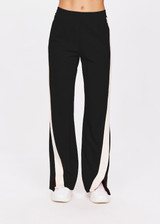 THE UPSIDE women's black Petra Flare is made from a lenzing viscose soft suiting fabrication. The full length tailored pant features side pockets and an elasticated waistband. Designed for walking and recovery.