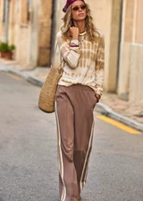 THE UPSIDE women's beige hand tie dyed Amana Long Sleeve Knit Top is made from organic cotton. This lightweight, long sleeve knitted top is designed for everyday wear and recovery.