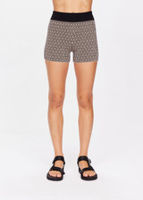 THE UPSIDE women's neutral abstract print Castilla 3 inch Knit Short is made from an organic cotton blend knit jacquard. This mid rise bike short features a soft elasticated waistband. Designed for yoga, pilates and lifestyle.
