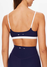 THE UPSIDE women's navy Hamptons Ballet Bra is made from recycled soft peached fabrication with a brushed handfeel and a breathable, quick drying effect. The low coverage ballet bra features elastic straps with adjusters. Designed for yoga and pilates.