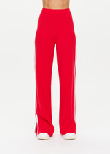 THE UPSIDE women's red Montana Freya Knit Pant is made from viscose blend. The straight pants features elastic waist and side stripe. Designed for lifestyle wear.