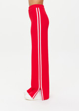 THE UPSIDE women's red Montana Freya Knit Pant is made from viscose blend. The straight pants features elastic waist and side stripe. Designed for lifestyle wear.
