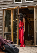 THE UPSIDE women's red Montana Freya Knit Pant is made from viscose blend. The straight pants features elastic waist and side stripe. Designed for lifestyle wear.