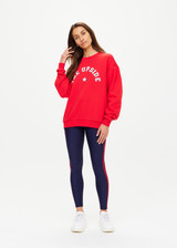 THE UPSIDE women's red Ranchero Saturn Crew Sweater is made from organic cotton. The oversized sweater features print western logo. Designed for lifestyle wear.