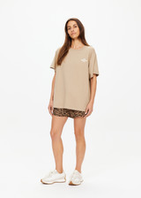 THE UPSIDE women's brown Palmino Sammi Tee is made from organic cotton. The oversized t-shirt features a soft rib neckline. Designed for comfort.