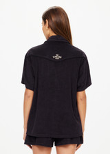 THE UPSIDE women's black Saddle Up Collared Hardy Shirt is made from hemp and cotton blend. The buttoned up shirt features pockets. Designed for comfort.