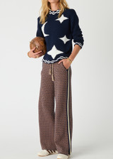 THE UPSIDE women's navy Eternity Clyde boxy Knit Crew Sweater is made with organic cotton and features cream detailing of stars and moons.