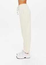 THE UPSIDE women's white organic cotton Hamilton Aries Track Pant is designed for a regular fit and features elasticated waistband and side seam pockets. Perfect for everyday.