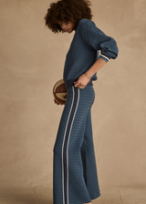 THE UPSIDE women's blue organic cotton Lumiere Dillon Knit Pant is designed for a relaxed fit and features a soft elasticated waist in a geometric star design. Made for lifestyle.