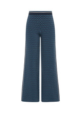 THE UPSIDE women's blue organic cotton Lumiere Dillon Knit Pant is designed for a relaxed fit and features a soft elasticated waist in a geometric star design. Made for lifestyle.
