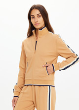 THE UPSIDE women's yellow Le Sport Margot Zip Jacket is designed for a slim fit and features pockets and textured knit side tapes. Perfect for travel and everyday.