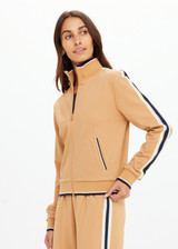 THE UPSIDE women's yellow Le Sport Margot Zip Jacket is designed for a slim fit and features pockets and textured knit side tapes. Perfect for travel and everyday.