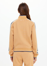 THE UPSIDE women's yellow Le Sport Margot Zip Jacket is designed for a slim fit and features pockets and textured knit side tapes. Perfect for travel and everyday.