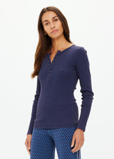 THE UPSIDE women's navy organic cotton Ness Ribbed Long Sleeve Top is designed for a slim fit. The perfect piece for layering and styling up or down.