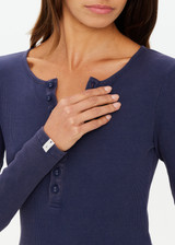 THE UPSIDE women's navy organic cotton Ness Ribbed Long Sleeve Top is designed for a slim fit. The perfect piece for layering and styling up or down.