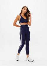 THE UPSIDE women's navy recycled peached Daytona Jetta Racerback Sports Bra is designed for a supportive fit and features removable cups. Made for yoga & pilates.